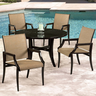 Relax on your patio with The Vantage Sling Dining Collection by Cast Classics