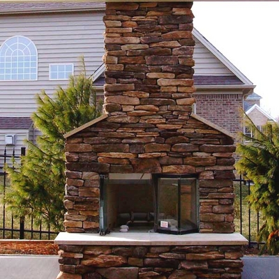 Finish Off Your Outdoor Room with This Impressive Custom Stone Fireplace